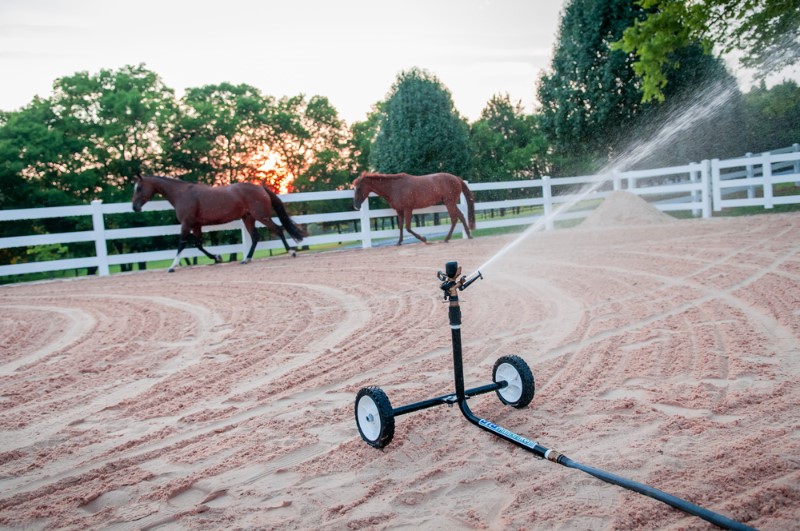 Kathy-Ziegler-Carly-Reba-escaping-the-Big-Sprinkler-in-their-new-Dressage-arena